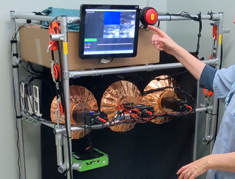 OMS researcher monitoring the data-recording rig deployed during a routine veterinary procedure